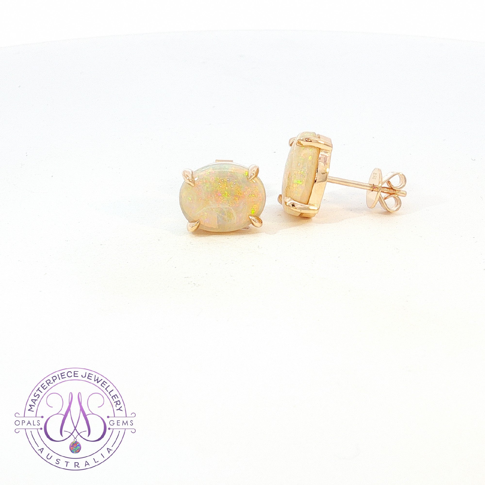 14kt Yellow Gold Dark Opal 3.3ct claw studs