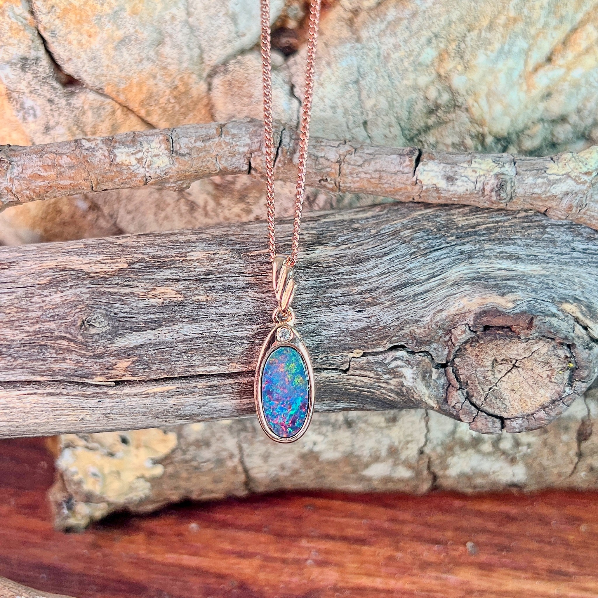 12 x 6.5mm Australian opal doublet pendant in rose gold-plated silver, red, blue, orange and green