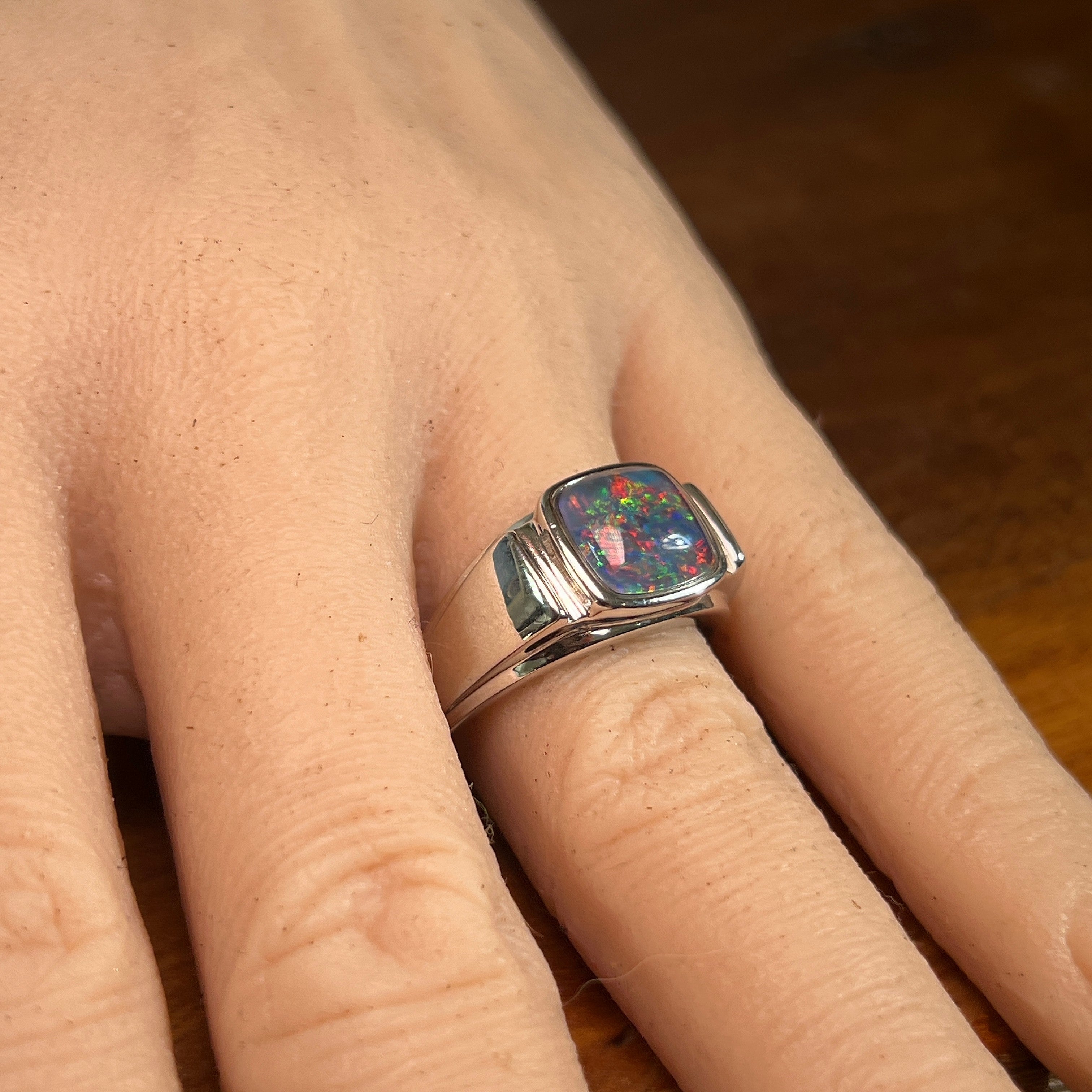 Australian opal triplet ring in sterling silver worn, cushion-shaped stone, size US 10