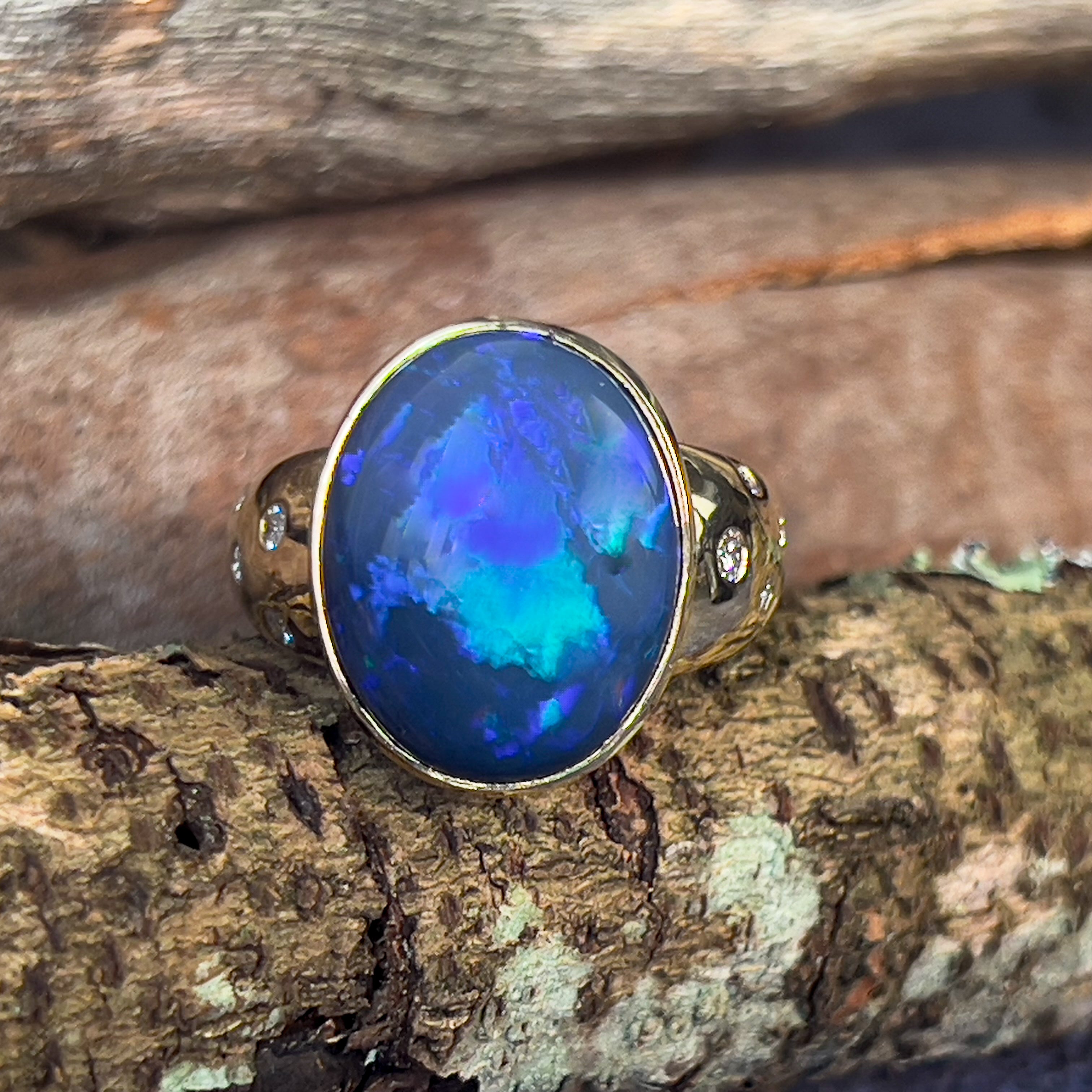 18kt Yellow Gold bezel set band Black Opal 6.05ct and diamonds flush set ring - Masterpiece Jewellery Opal & Gems Sydney Australia | Online Shop