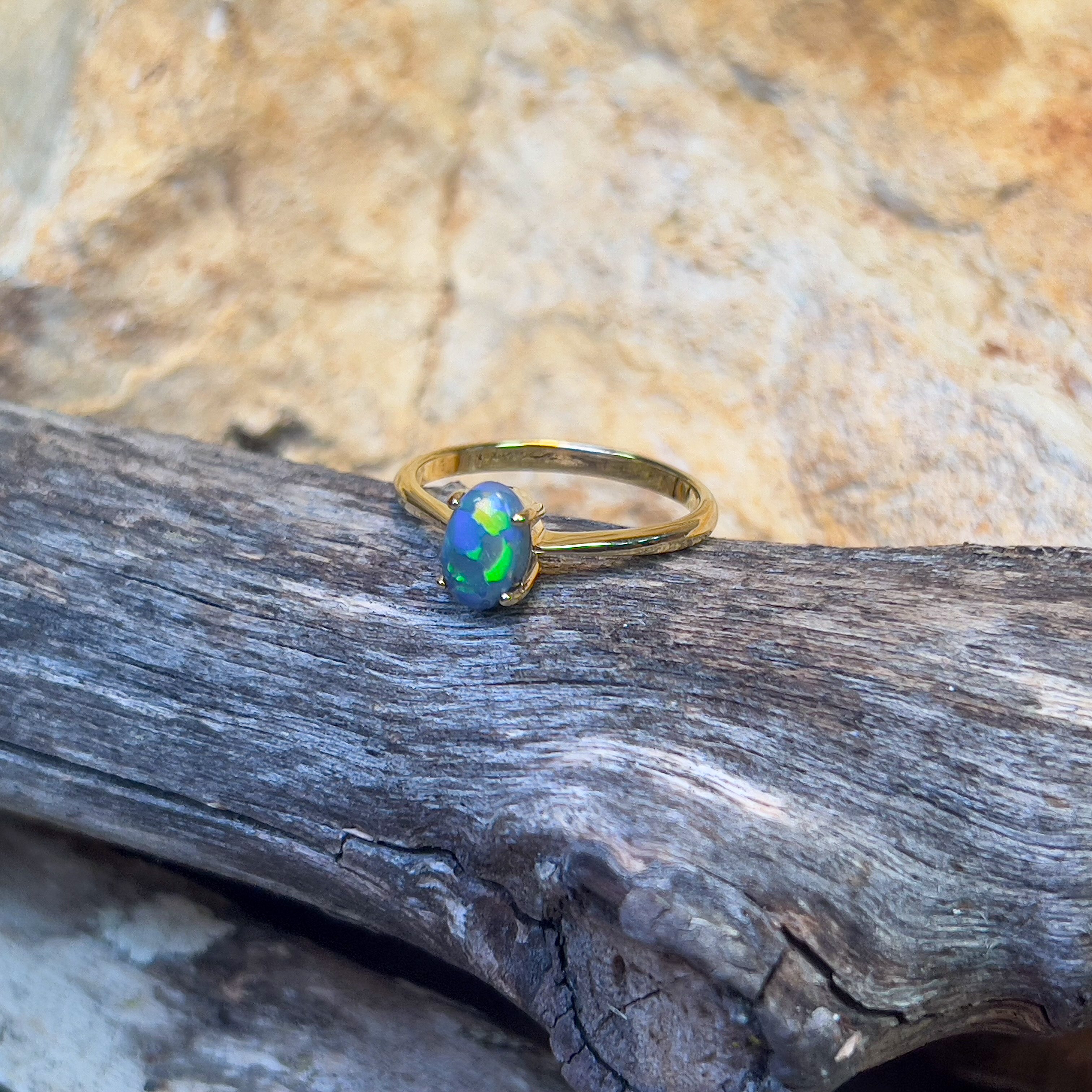18kt Yellow Gold solitaire ring set with one 0.65ct Black Opal - Masterpiece Jewellery Opal & Gems Sydney Australia | Online Shop