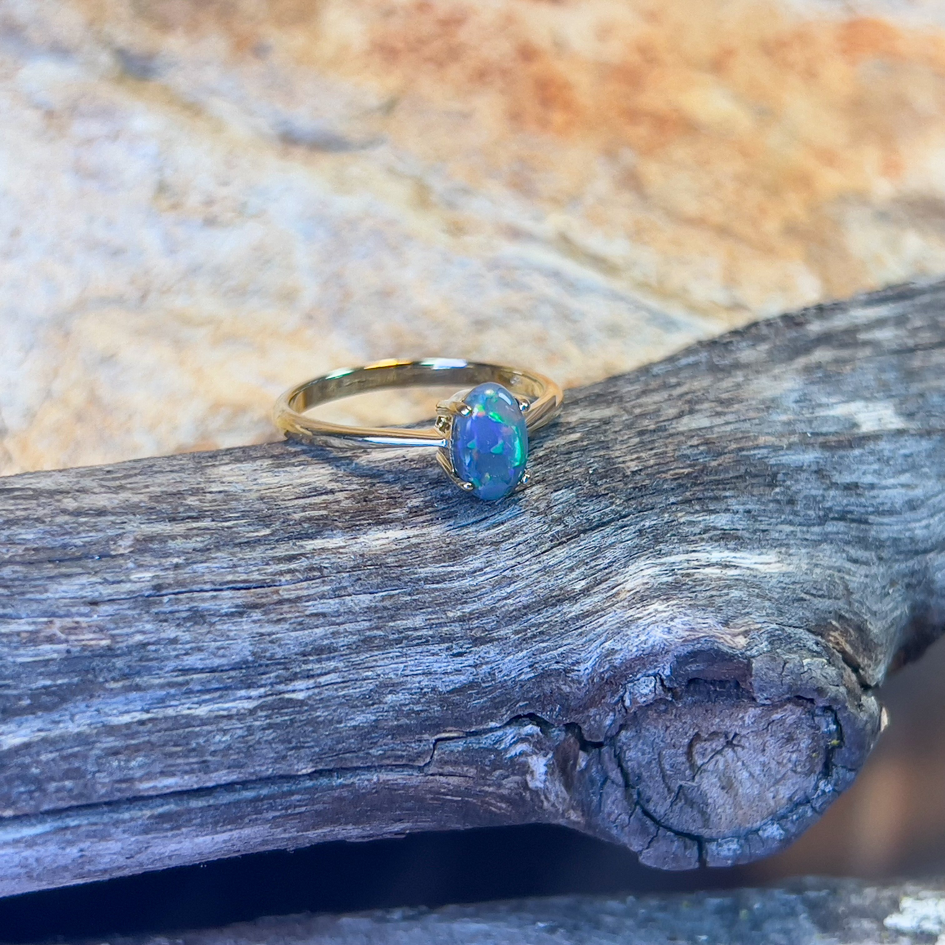18kt Yellow Gold solitaire ring set with one 0.65ct Black Opal - Masterpiece Jewellery Opal & Gems Sydney Australia | Online Shop