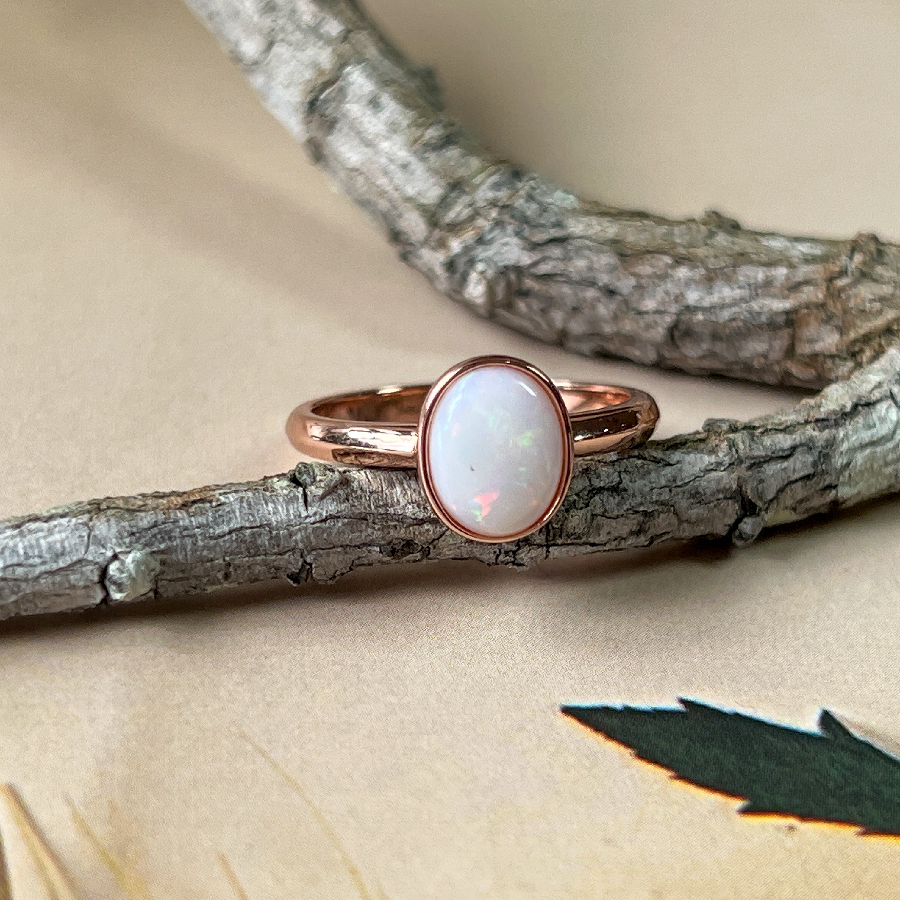 Bezel-Set Solitaire White Opal Ring - 10x8mm, Rose Gold-Plated Sterling Silver, Elegant Minimalist Jewelry, Perfect Gift for Her - Masterpiece Jewellery Opal & Gems Sydney Australia | Online Shop