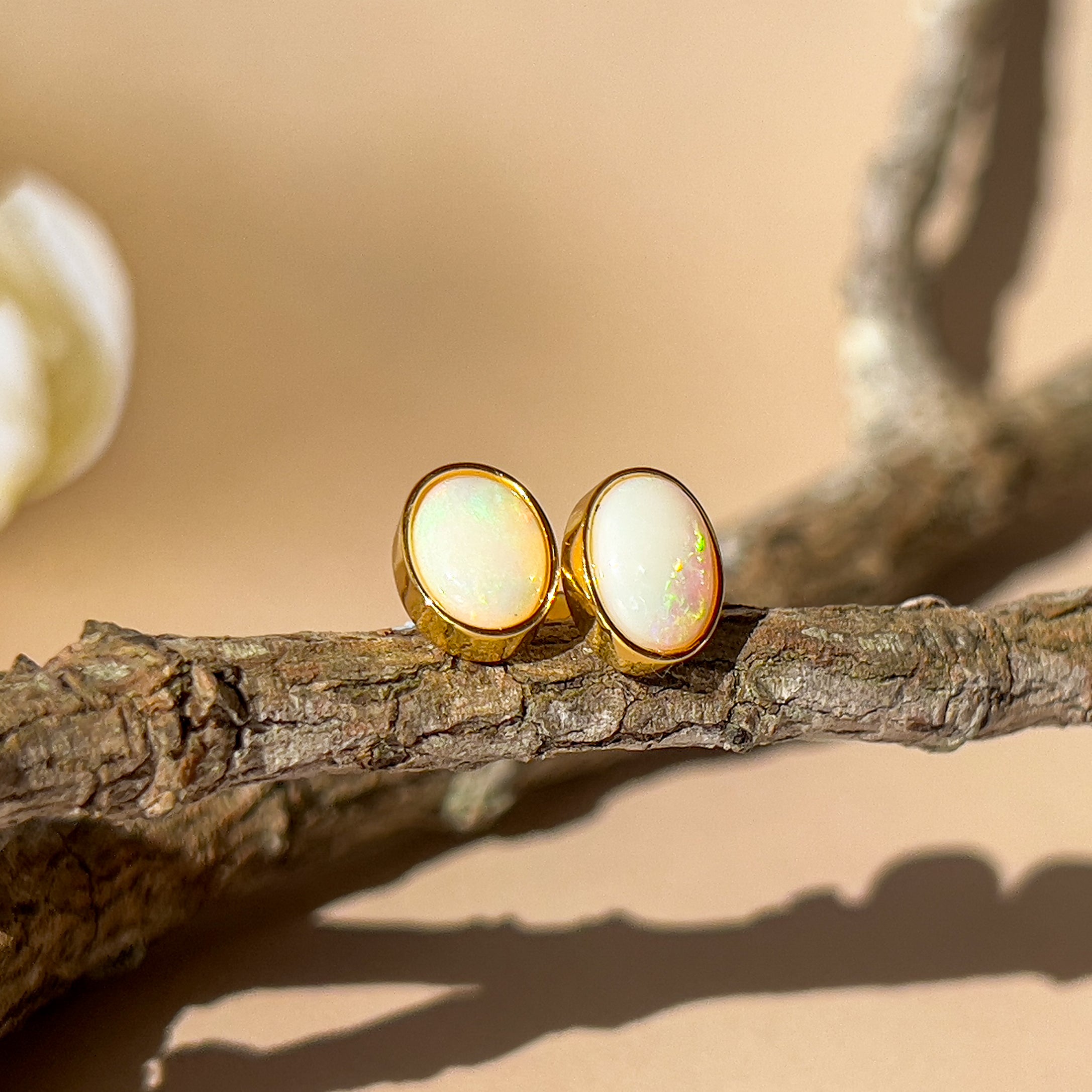 One pair of Gold plated sterling silver 8x6mm White Opal earrings bezel set - Masterpiece Jewellery Opal & Gems Sydney Australia | Online Shop