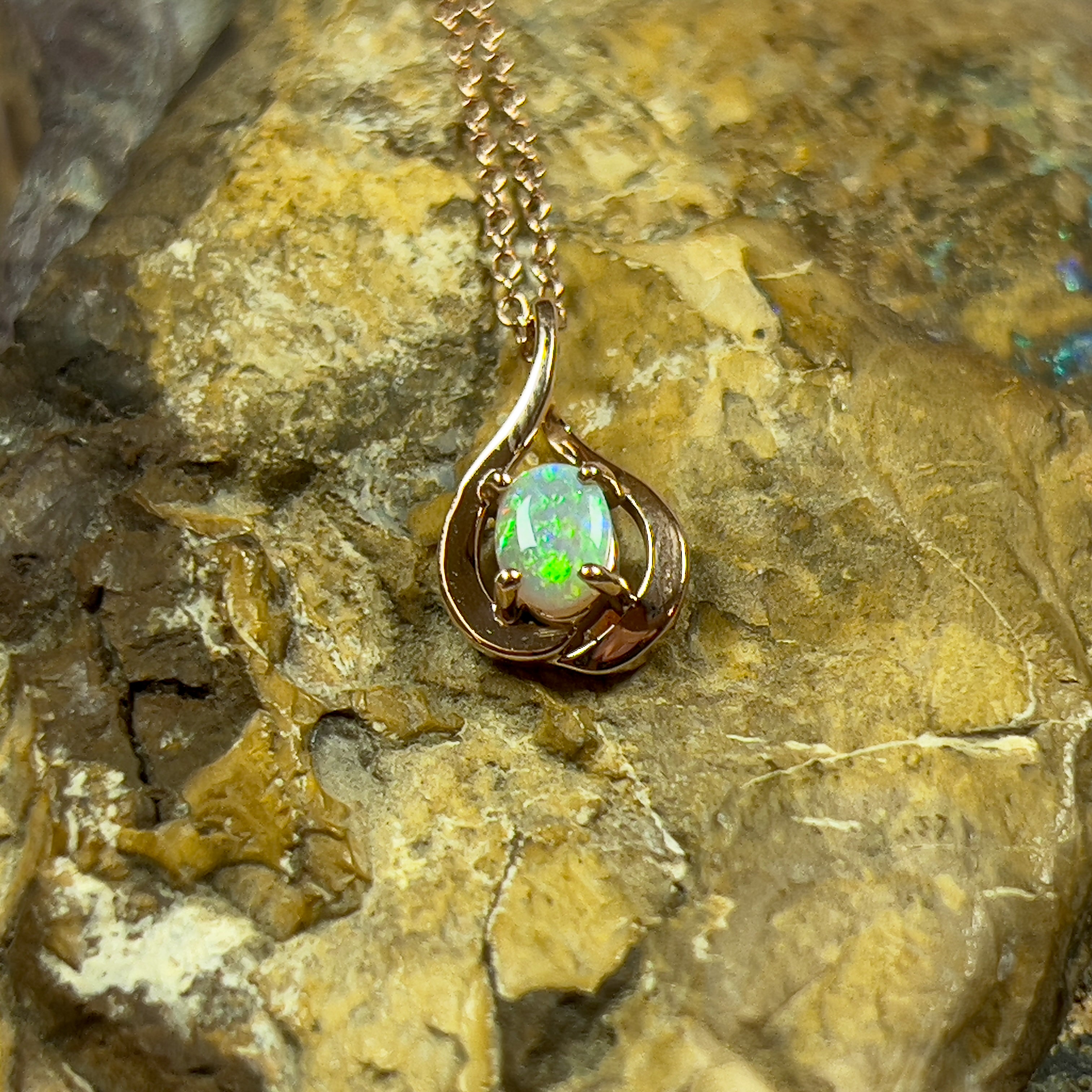 14kt Rose Gold swirl pendant with one Black Opal 0.33ct - Masterpiece Jewellery Opal & Gems Sydney Australia | Online Shop