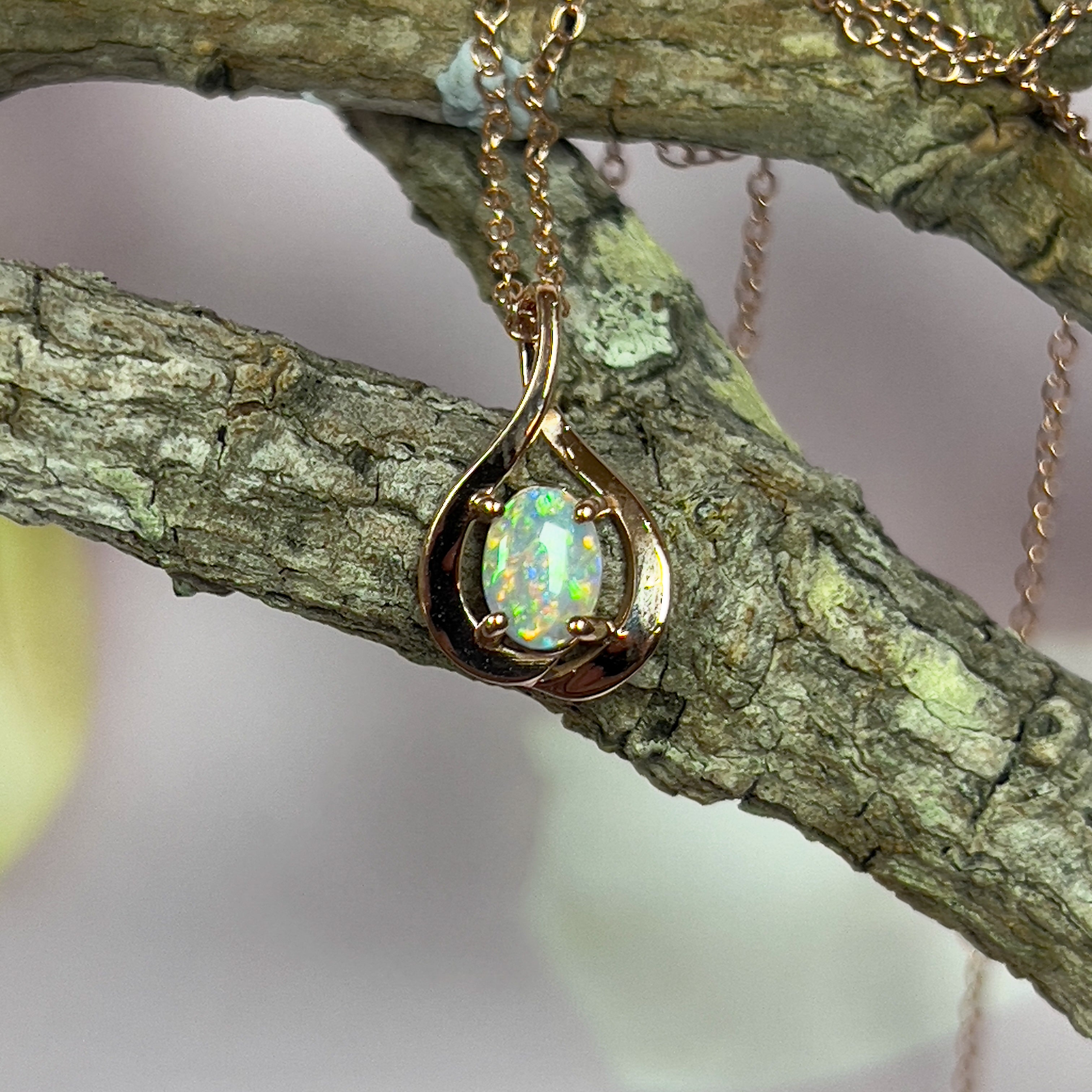 14kt Rose Gold swirl pendant with one Black Opal 0.33ct - Masterpiece Jewellery Opal & Gems Sydney Australia | Online Shop