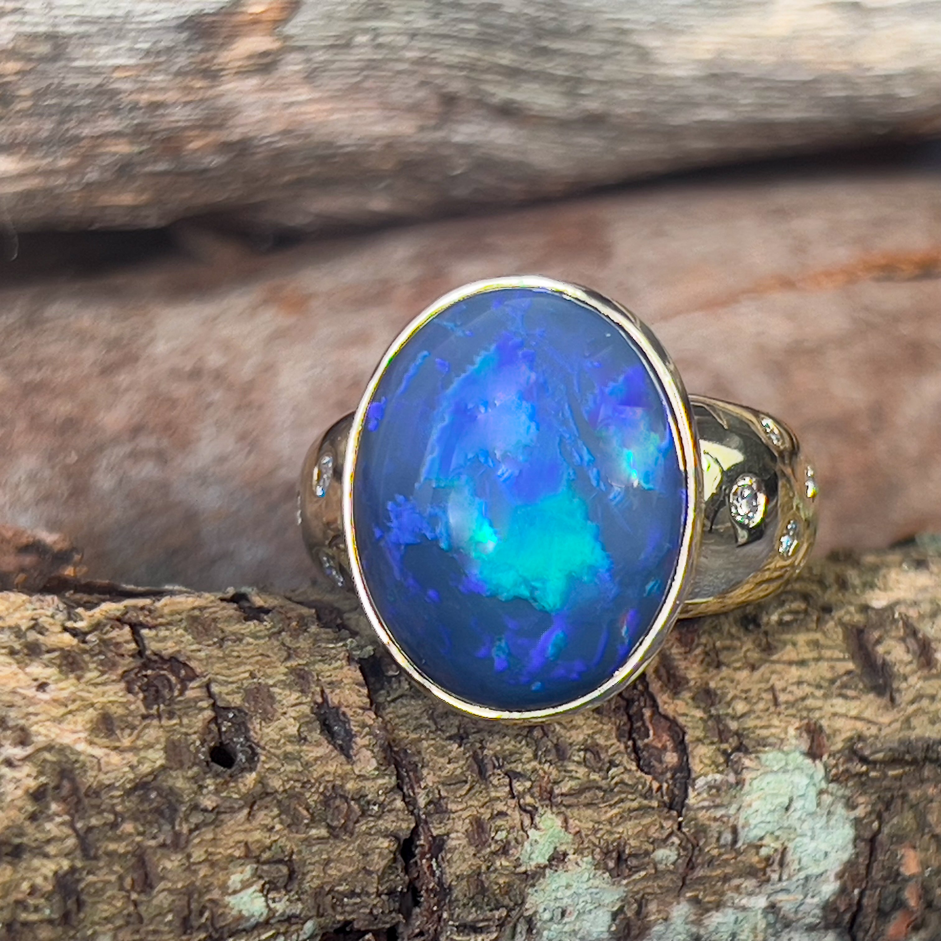 18kt Yellow Gold bezel set band Black Opal 6.05ct and diamonds flush set ring - Masterpiece Jewellery Opal & Gems Sydney Australia | Online Shop