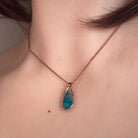 Australian opal doublet pendant worn at the neck, rose gold-plated silver, 12 x 6.5mm freeform stone