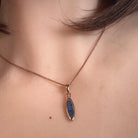 Worn Australian opal doublet pendant in rose gold-plated silver, green, red, blue and yellow, 16 x 5mm