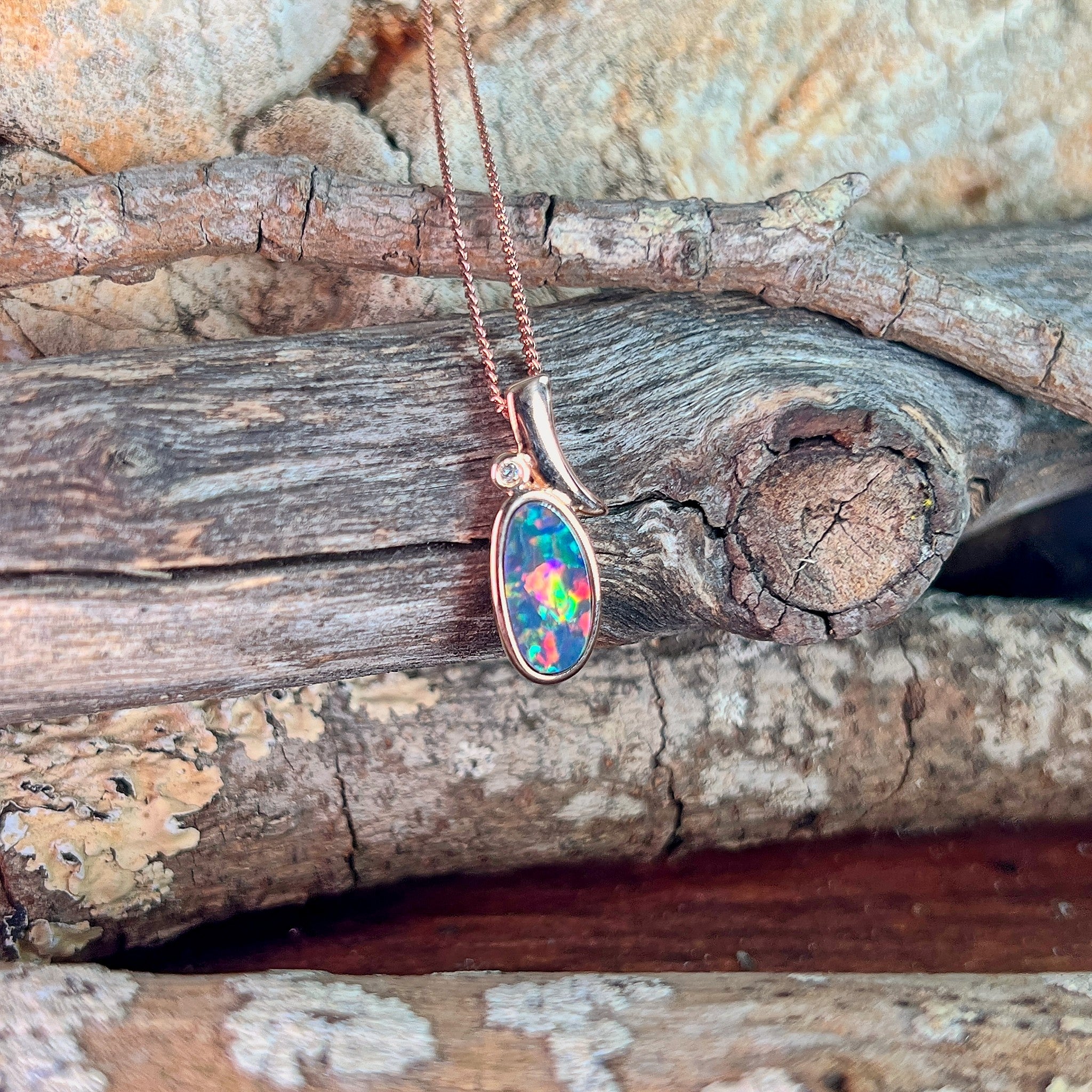 rose gold-plated silver Australian opal doublet pendant with a 13 x 7mm oval stone