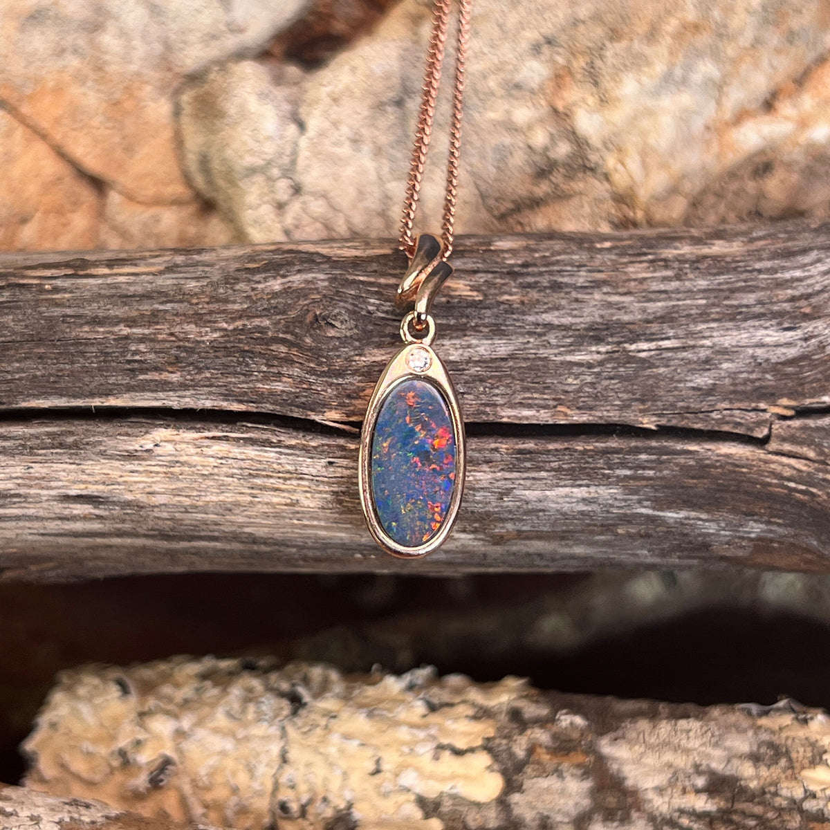 oval Australian opal doublet pendant in rose gold-plated silver, red and blue play-of-colour