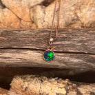 Australian opal doublet pendant, rose gold-plated silver, 6mm stone showing green, red and blue
