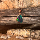 freeform Australian opal triplet pendant in rose gold-plated silver, red, green and blue play-of-colour