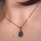 Australian opal triplet pendant worn at the neck, rose gold-plated silver, 12 x 8mm freeform stone