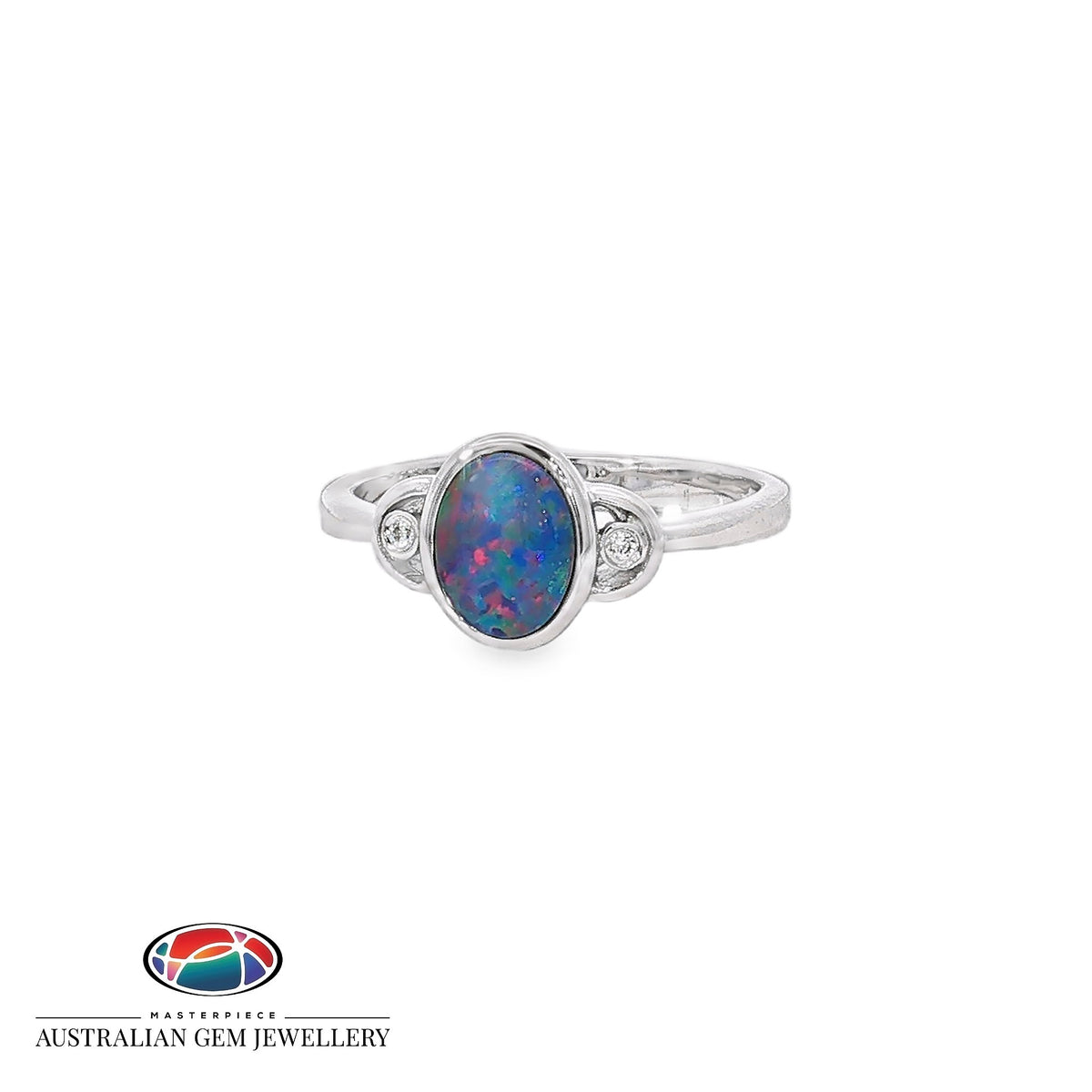 Oval opal doublet ring in sterling silver, bezel set with a cubic zirconia to each side, showing blue, red and green play of colour