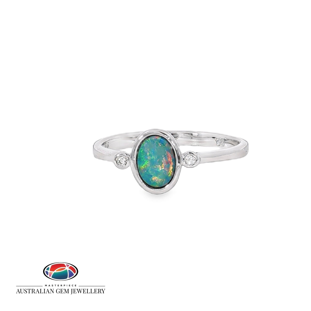 Oval opal doublet ring in sterling silver with a cubic zirconia to each side, showing blue, red and green play of colour