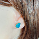Australian opal doublet earrings worn on the ear, sterling silver, 10 x 8mm triangular stones