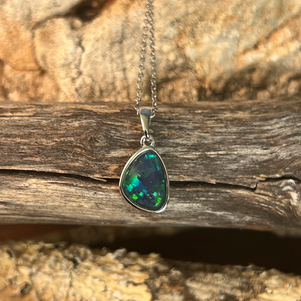 freeform Australian opal triplet pendant in sterling silver, blue and green play-of-colour