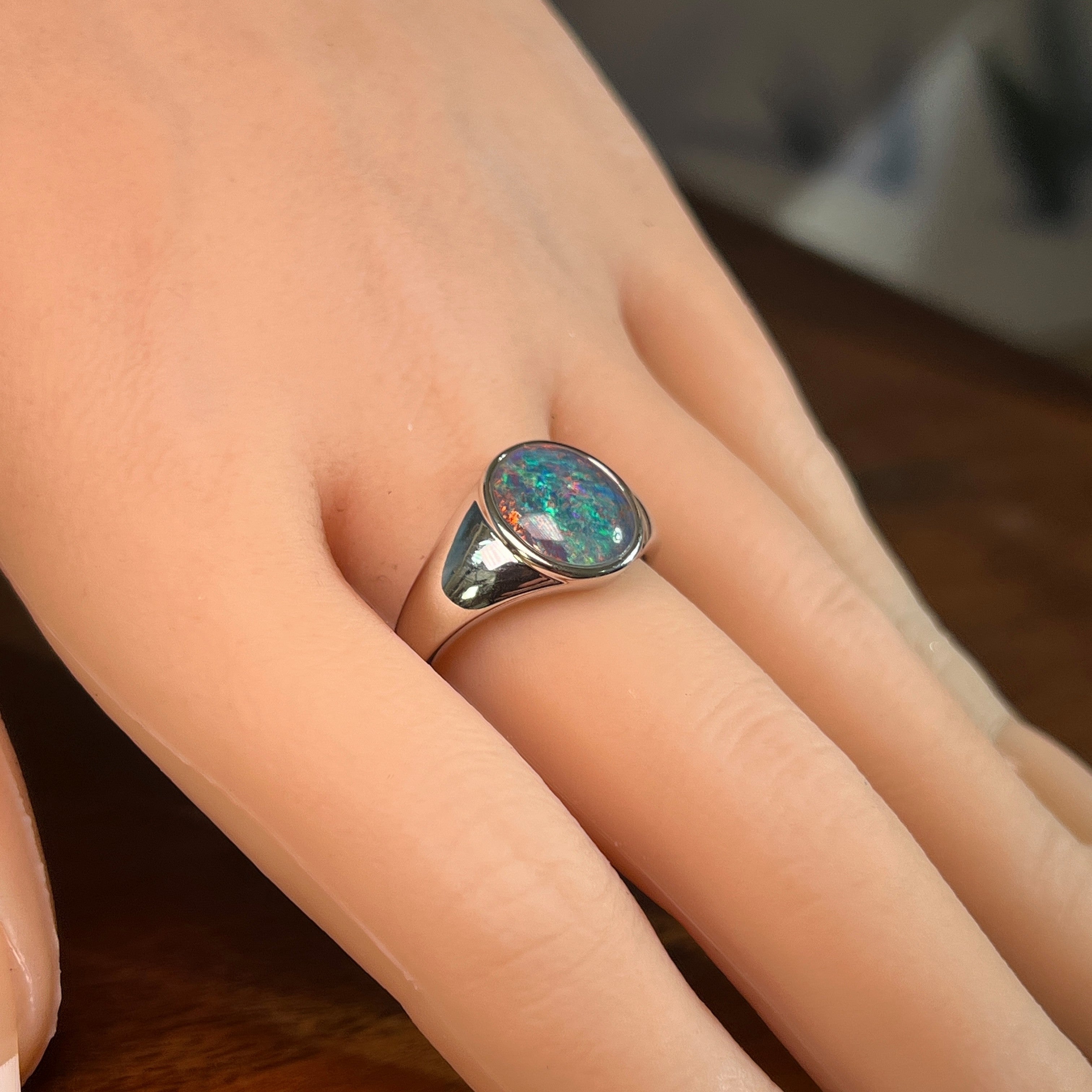 Australian opal triplet ring in sterling silver worn, oval stone, size US 10