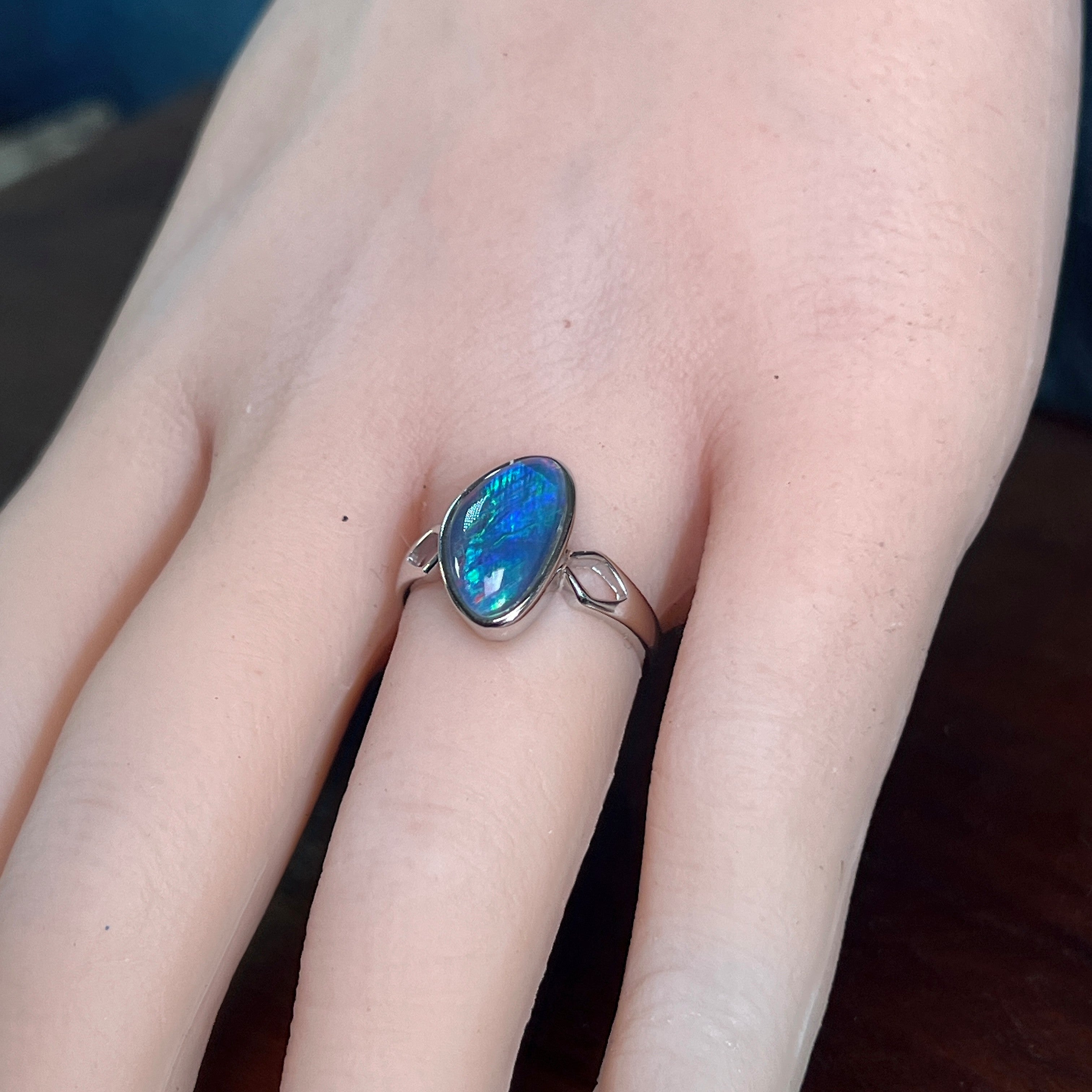 Australian opal triplet ring on the hand, sterling silver, 13 x 8mm triangular stone