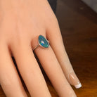 14 x 8.5mm triangular Australian opal triplet ring on the hand, sterling silver
