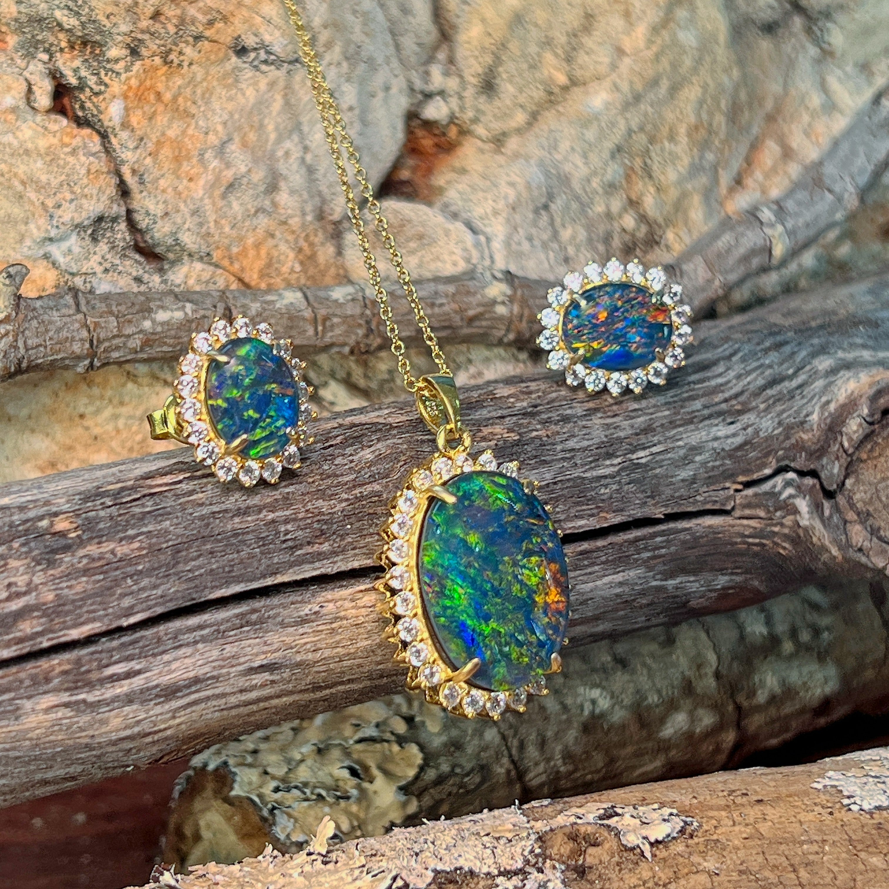 18x13mm oval opal triplet halo pendant with matching studs, showing green and red fire