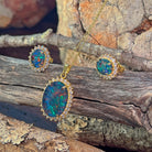 Close view of the opal triplet halo pendant and 10x8mm cluster earrings in gold-plated silver