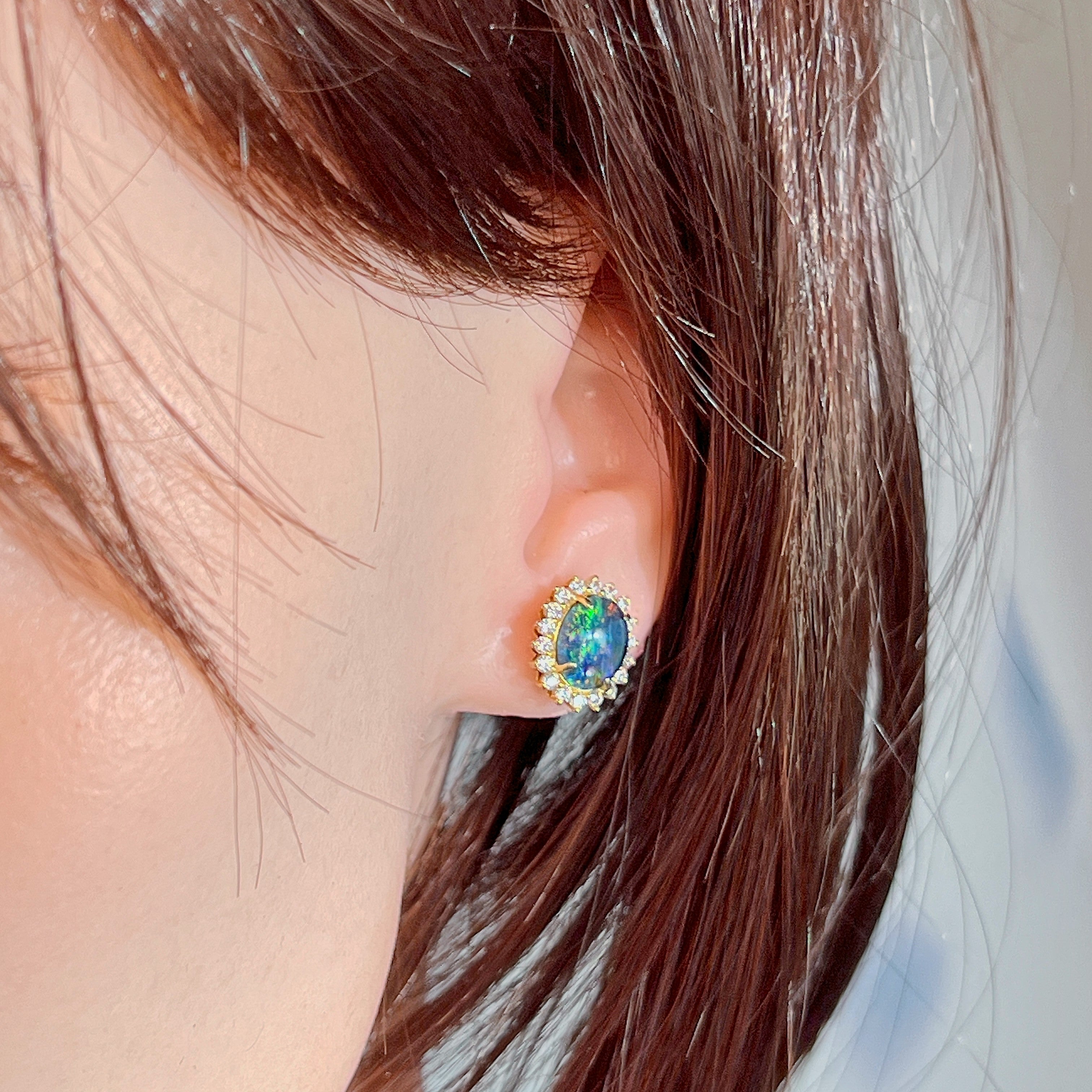 Gold-plated silver opal triplet cluster stud worn on the ear, side profile view