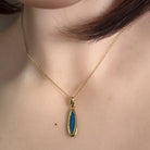 17 x 5mm marquise Australian opal doublet pendant worn at the neck, yellow gold-plated silver