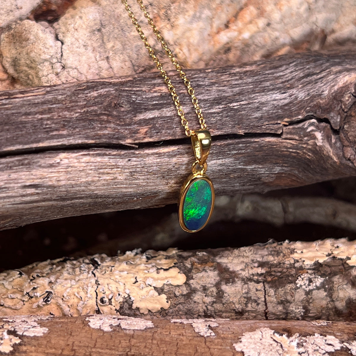yellow gold-plated silver Australian opal doublet pendant with a 12 x 6mm oval stone