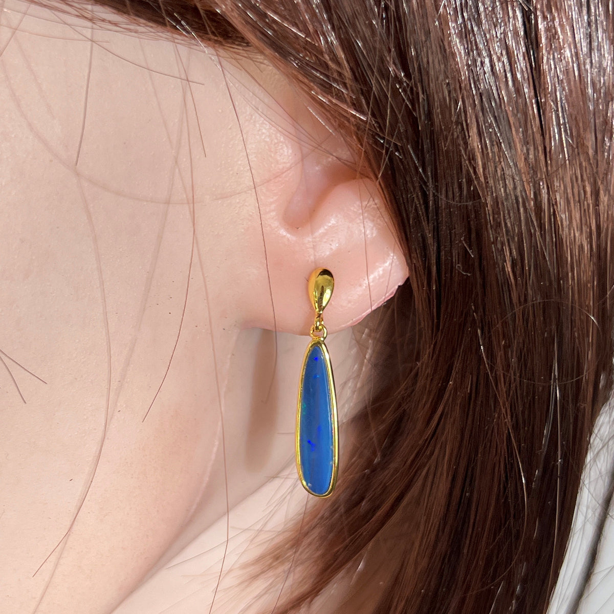 Australian opal doublet earrings worn on the ear, yellow gold-plated silver, 22 x 5.5mm pear-shaped stones