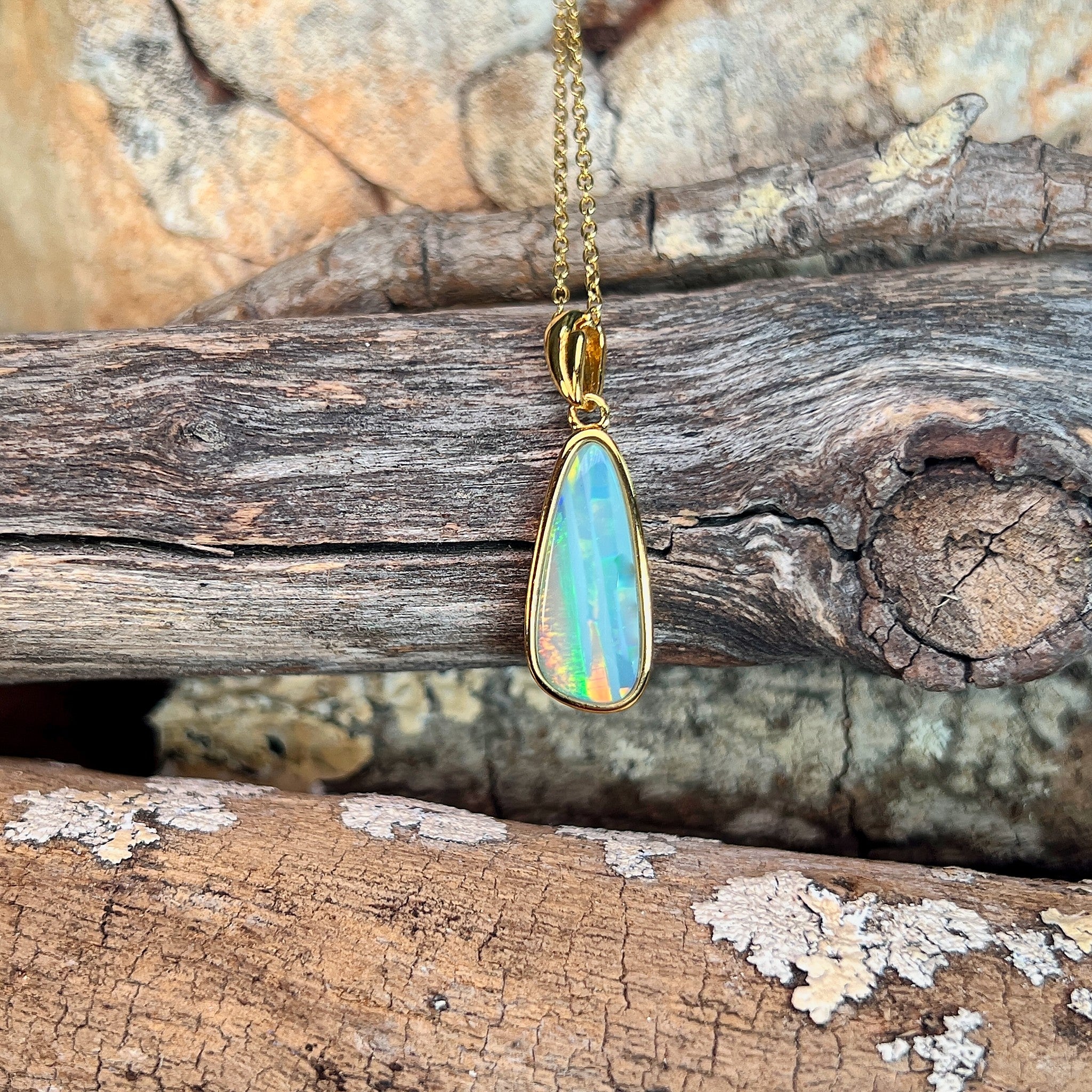 pear-shaped Australian opal doublet pendant in yellow gold-plated silver, green, blue, red and yellow play-of-colour