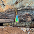 Australian opal doublet pendant, yellow gold-plated silver, 17 x 6mm stone showing green, blue, red and yellow