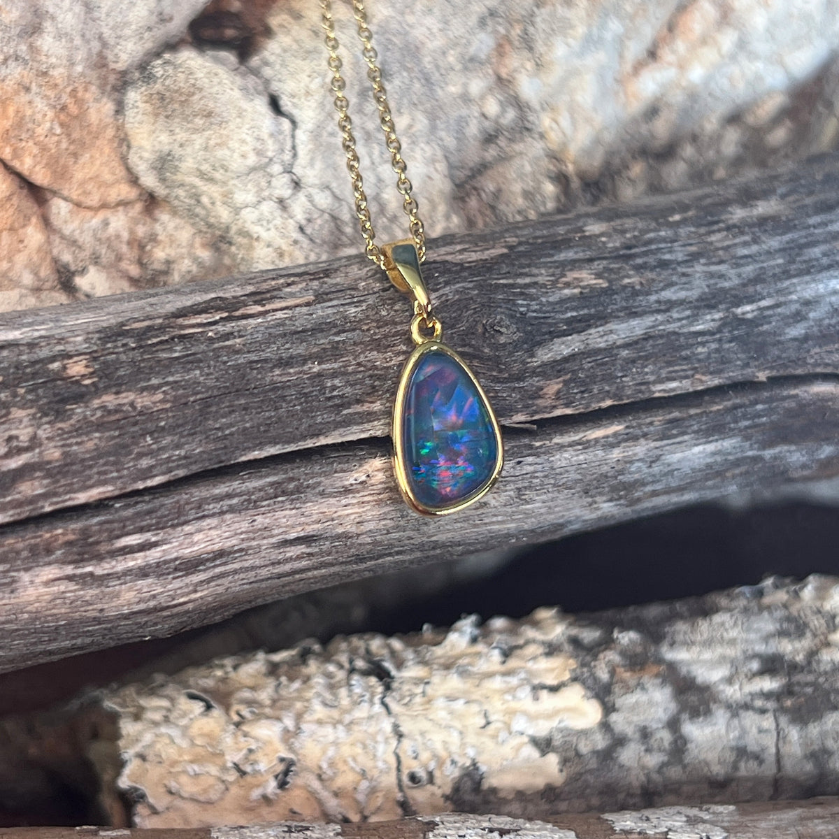 11 x 8mm Australian opal triplet pendant in yellow gold-plated silver, red, green and blue